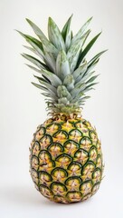 Fototapeta premium A fresh pineapple is beautifully sitting on a clean white surface