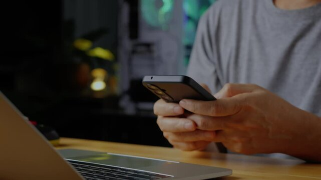 A person using a smart phone for message or texting or chat in an office for work or business