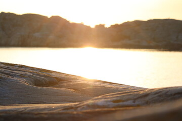 sunset over the ocean and cliffs 