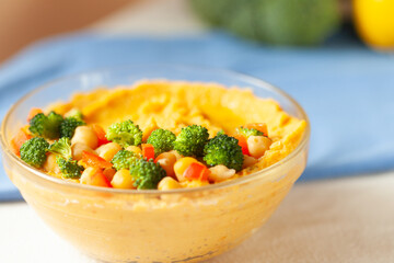 Creamy dip topped with chickpeas and broccoli florets. A healthy and delicious snack or appetizer.