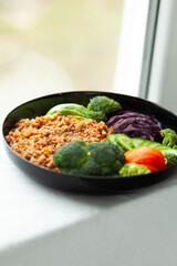 Healthy and delicious buckwheat bowl with assorted vegetables. Perfect for a nutritious and balanced meal.