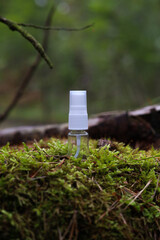 Tube of cosmetics on a stone among the leaves. The concept of natural plant cosmetics. Mockup.