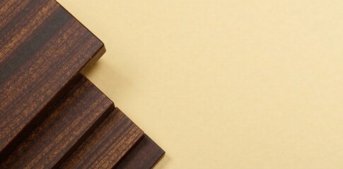 Dark wooden table corner on beige background, dark, isolation, wooden table