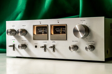 Vintage hi-fi stereo amplifier with power output meters and aluminum knobs