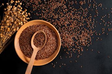 Healthy food. Healthy grains. Flax seeds in a wooden plate