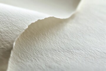 Close-up view of blank textured paper with subtle grain details, ideal for background