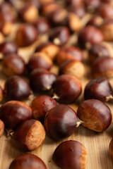 Chestnuts on a wooden background