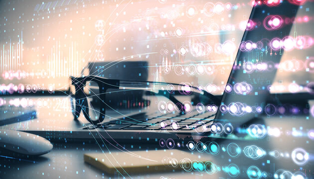 Abstract digital overlay of holographic data visuals with a laptop, glasses, and coffee cup on a desk in office setting. - Powered by Adobe