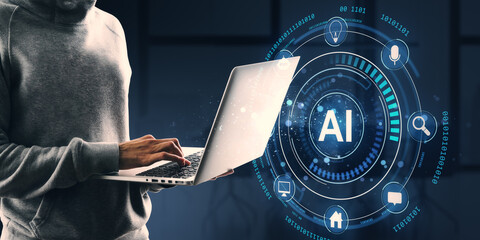 Person using laptop with AI technology icons on digital background.
