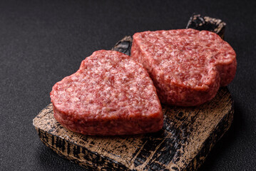 Raw beef or pork burger patty in the shape of a heart