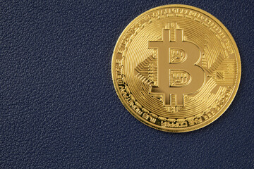 Cryptocurrency, golden Bitcoin close-up. Coin close-up. Copy space