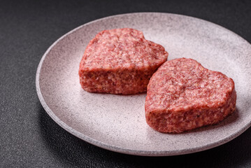 Raw beef or pork burger patty in the shape of a heart