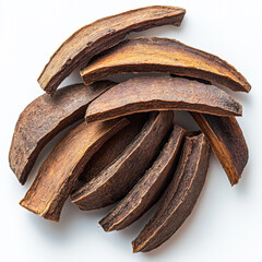 Pile of brown, dried up pieces of fruit. The fruit is cut into slices and arranged in a pile