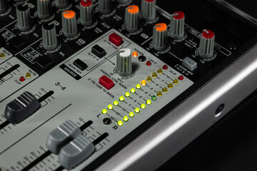 Photograph of faders analog mixer analog mixer dj professional sound mixing. Concept: Technology, sound engineering, sound, sound, mixing.