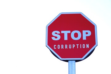 stop corruption concept. words written on traffic stop sign.