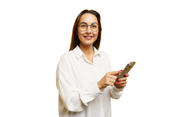 Smiling woman in white shirt using smartphone while standing against white background