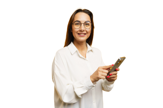 Smiling woman in white shirt using smartphone while standing against white background - Powered by Adobe