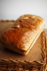 Crispy freshly baked homemade bread on a wood table