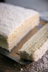 Delicious white Raffaello cake with coconut flakes
