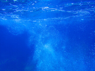 Air bubbles underwater rising to water surface, natural scene, bubbles under water, bubble undersea, sea in crystal clear green water. Real image very suitable for backgrounds, Great for background.