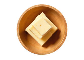Overhead shot of cubed cheese in a wooden bowl Ideal for food blogs recipe websites or advertising