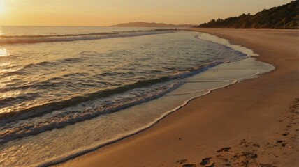 A serene sunset over the ocean, reflecting warm colors on the water.