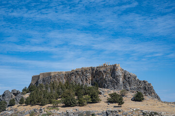 Hilltop Lindos acropolis located on Greek island of Rhodes captured on a sunny day