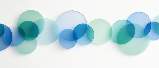 Translucent overlapping circles in shades of blue and green create minimalist design