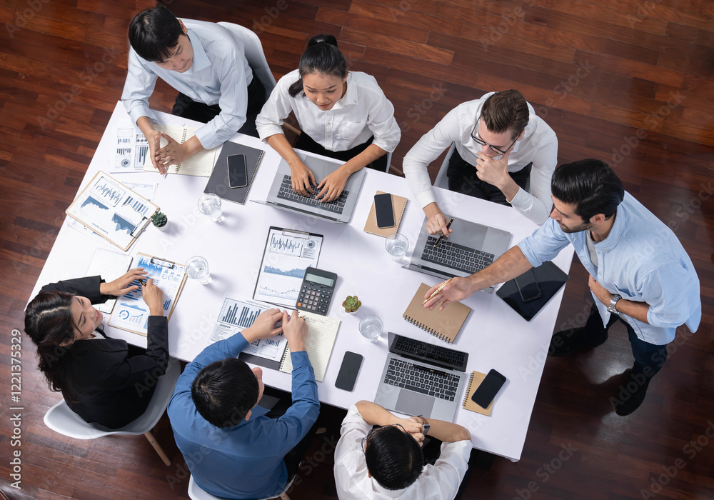 Leinwandbilder Top view analyst team utilizing BI Fintech to analyze financial data at table in meeting room. Analytic BI dashboard power on paper for business insight and strategic marketing planning. Prudent