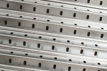 Perforated metal profiles for adjustable shelving unit as background