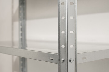 Empty stainless steel metal shelving unit with adjustable shelf for storage organization