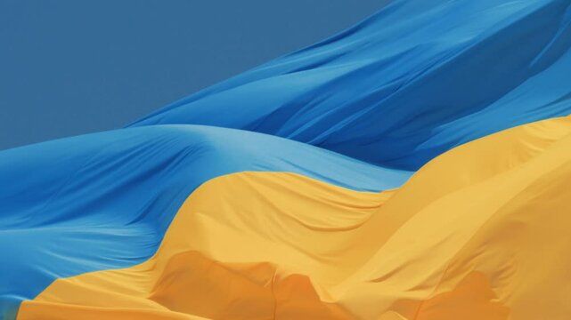 Waving the Ukrainian Flag High Against a Beautifully Clear Sky to Celebrate Freedom and Culture