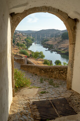 Obraz premium Overlooking the bridge under the Guadiana river in the Alentejo locality of Mertola. Portugal.