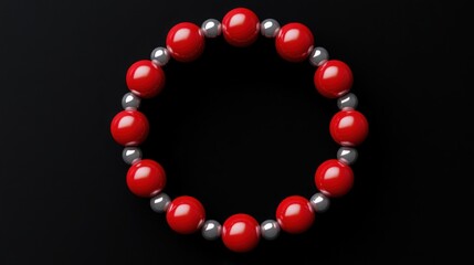 Red and Silver Beads Bracelet: A minimalist photo of a red and silver beaded bracelet arranged in a circle, against a black background.
