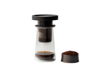 A clear Aeropress setup with coffee grounds and hot water, showcasing the unique brewing process, isolated on a white background