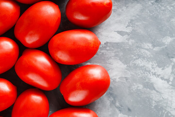 Farm-Fresh Red Tomatoes on Concrete Surface for Raw Food and Vegetarian Cooking, Top View, Copy Space