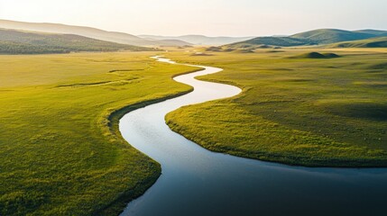 A long river runs through a grassy plain