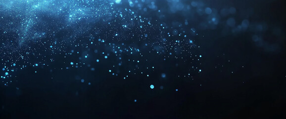 Fototapeta premium Blue glowing dust particles with bokeh effect and light flare in dark space