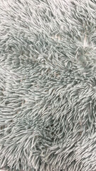 Soft Sage Green Fluffy Rug Texture Close-Up, Ideal For Home Decor, Modern Interiors, And Comfort-Oriented Textile Designs Highlighting Tranquility And Elegance.