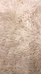 Beige Fluffy Rug Texture Close-Up, Suitable For Home Decor, Interior Design Projects, Textile Backgrounds, And Soft Furnishings Marketing Highlighting Comfort And Warmth.