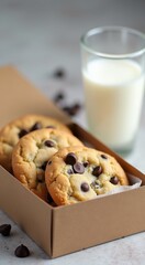 Two cookies in a box next to a glass of milk