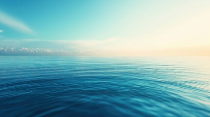 Fototapeta premium The ocean is calm and blue, with a few clouds in the sky