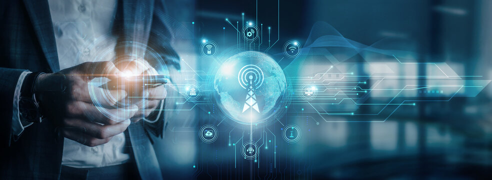 Businessman using mobile device to interact with telecommunications network infrastructure, global network connectivity, and telecommunications services solutions platforms.
