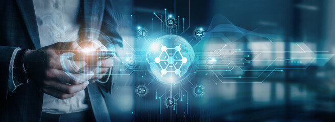 Businessman using mobile devices to interact with nanotechnology applications in global network connectivity and nanotechnology advancements in digital communication.