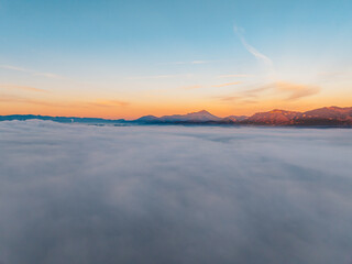 Sunset over Liptov region with and High Tatras mountains around. Liptovsky Mikulas landspace, slovakia.