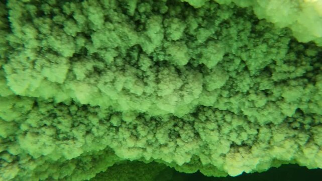 Underwater (GoPro) shot of thick chunks of salt in the Danakil desert in Ethiopia, surreal natural landscape in Africa
