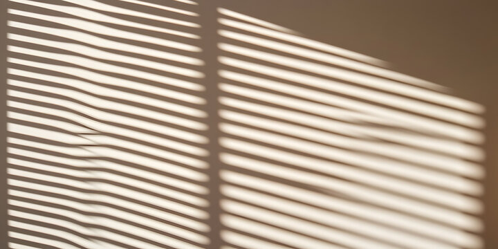 Sunlight streams through window blinds, casting parallel lines of light and shadow on a wall. A minimalist and abstract image perfect for backgrounds or design.