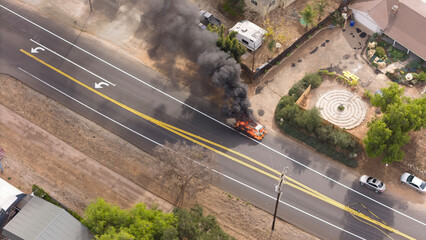 Ojai, California, USA, Sunday January 26th, 2025. Electric Car Fire amidst the Pacific Palisades, Eaton Fire Wildfire event. Police and fire department are in attendance Aerial Drone view
