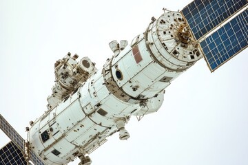 A space station with a satellite in the foreground, great for science fiction or technology concepts