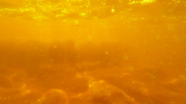 Underwater scene of bubbling hot springs in Danakil desert in Ethiopia
